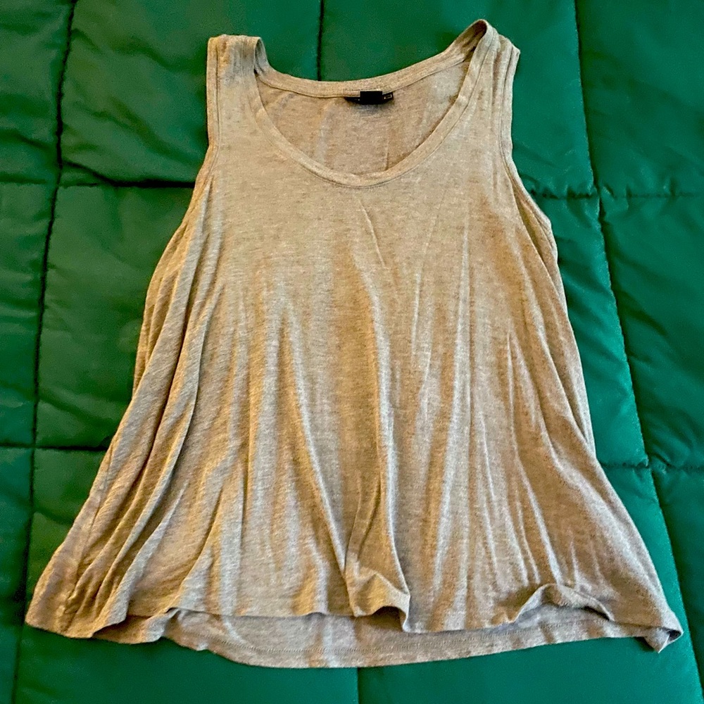 This tank top is from the brand Metaphor it is grey flows nicely and is stretchy